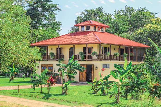 A house in Carmelita Gardens with banana trees