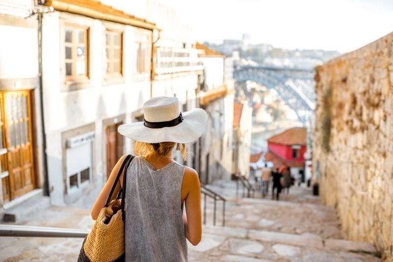 Young woman tourist walking in Porto city, Portugal
