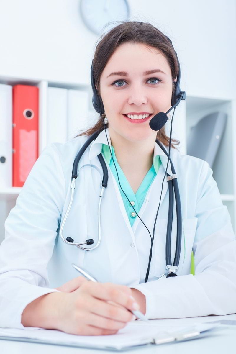 Call center operator woman in medical clinic. 