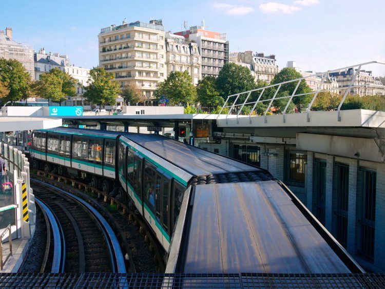 Paris Metro train stopping at Bastille Station