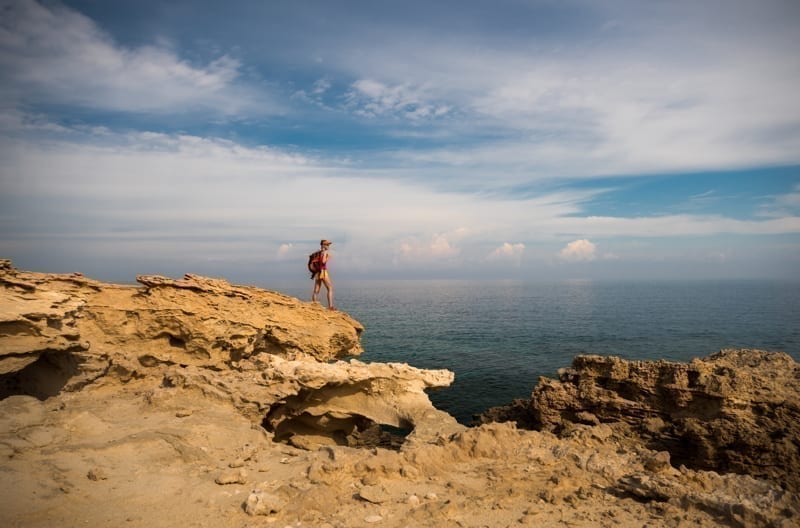 Hiker enjoying view of a Blue Lagoon near Polis city, Cyprus. 