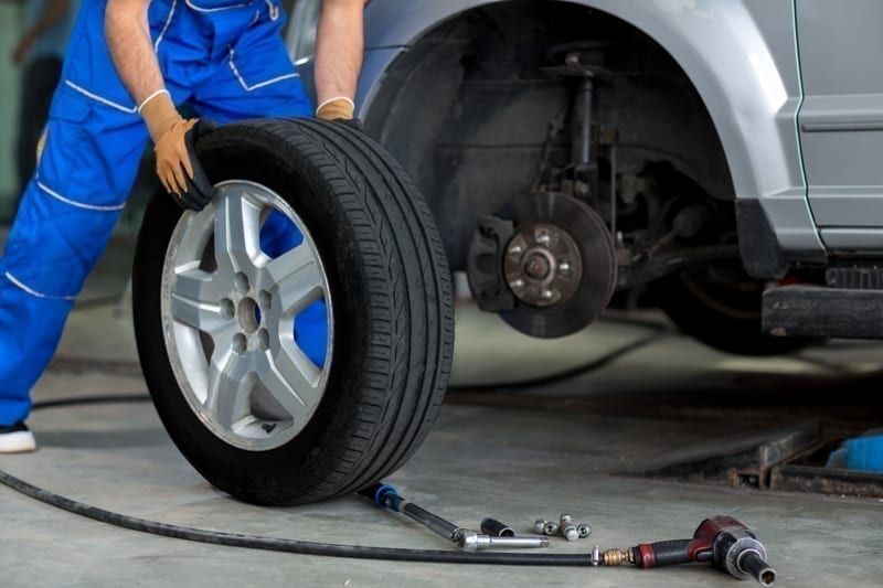  A mechanic changing a tire. 