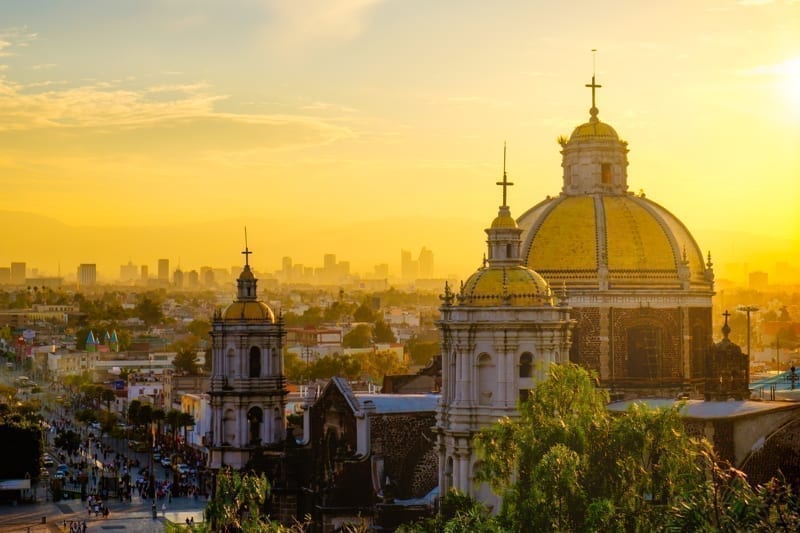  Basilica of Guadalupe with Mexico city skyline at sunset, Mexico