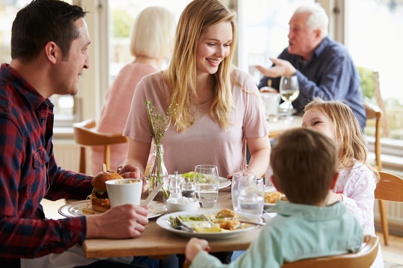 Family celebrating Mother’s Day at a restaurant 