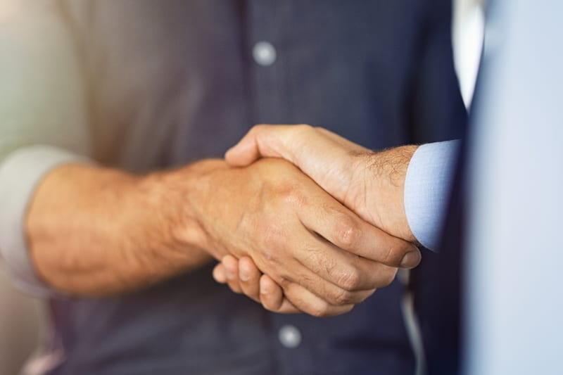 Close up of friendly handshake