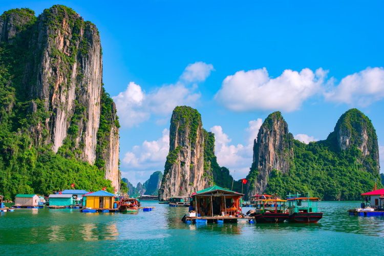 Floating fishing village and rock island in Halong Bay, Vietnam