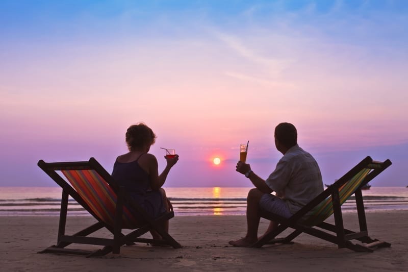 Couple on the beach. taxes in Belize taxes