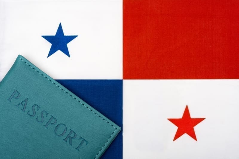 On the background of the flag of Panama is a passport. 