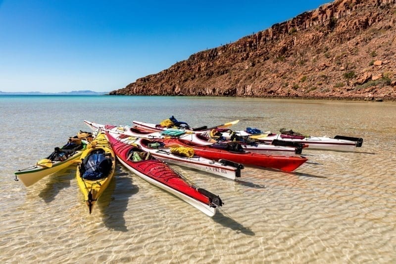 Kayaks float in a bay off Isla Espíritu Santo in the Gulf of California offshore of La Paz on the Baja California Peninsula, Mexico