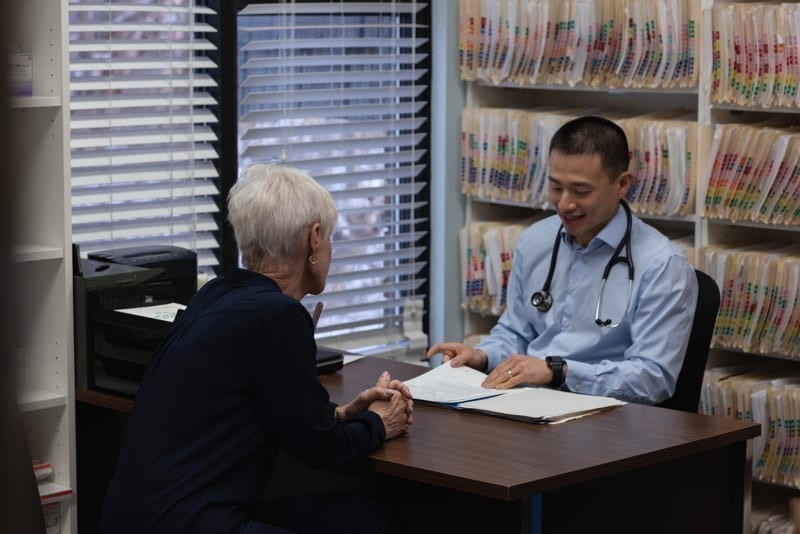 Young doctor and senior patient