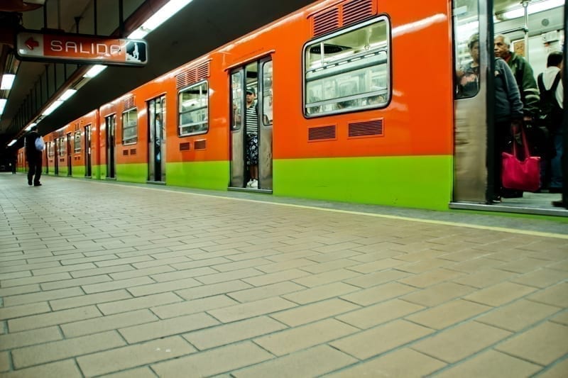 Subway train and walk at station on a common day on Mexico City, Mexico.