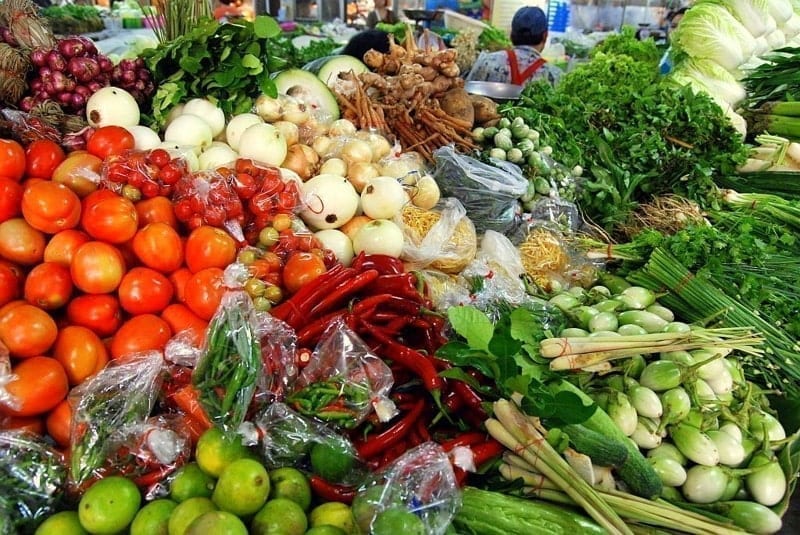 Fresh herbs, fresh spices and vegetables sold at a stall in Thanin Market, Chiang Mai, Thailand.