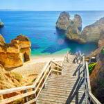 Wooden footbridge to beautiful beach Praia do Camilo near Lagos