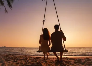 silhouette of romantic couple on sunset beach