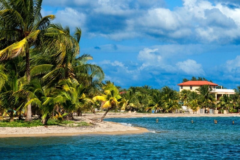 Cottages in front of the beach in Placencia, Belize.