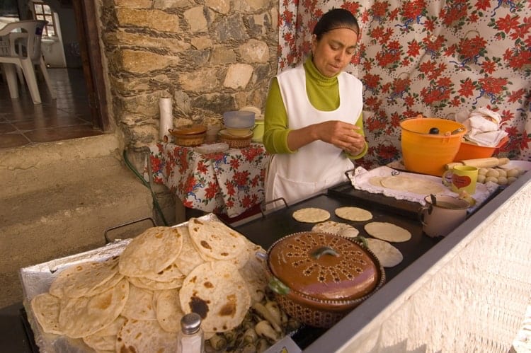 Market woman making tortillas inSan Luis Potosi Real de Catorce, Mexico