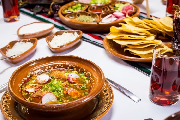 Trditional pozole mexican food table