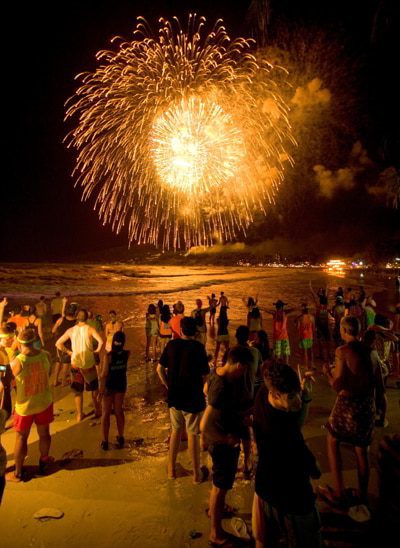 People seeing the new year at the full moon beach party in Koh Phangan, Thailand