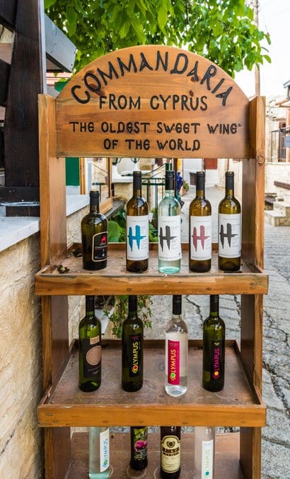 A stand selling local sweet wine in the traditional village of Omodos in Cyprus