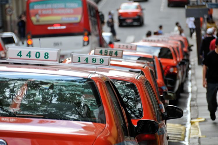Line of taxi cabs parked by the curb side, downtown, Porto Alegre, Rio Grande do Sul, Brazil