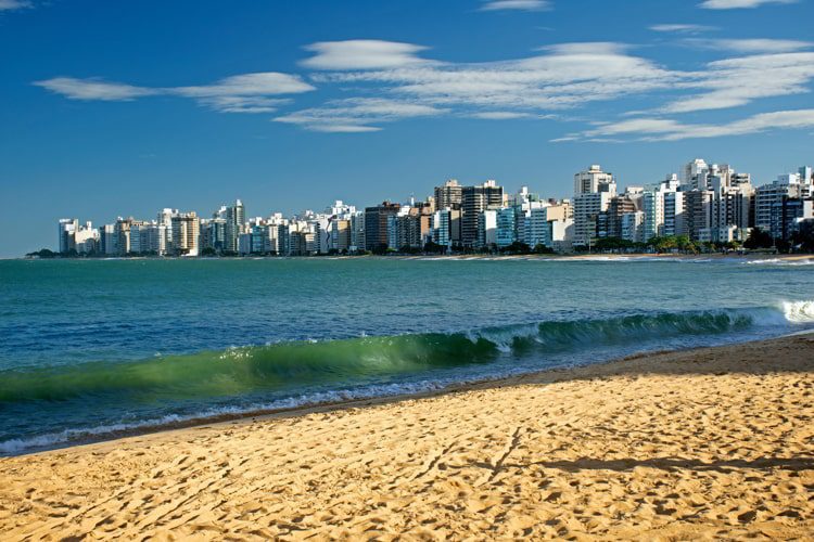 A wave crashes at Praia da Costa, Vila Velha, Espirito Santo, Brazil