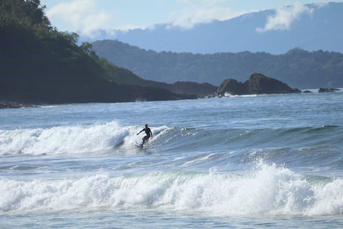 A person surfing in Playa Morrillo, Panama