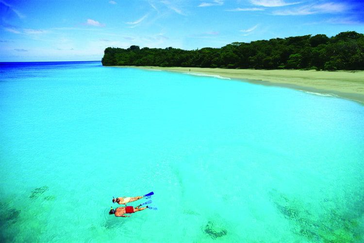 People snorkeling in Red Frog Beach in Panama