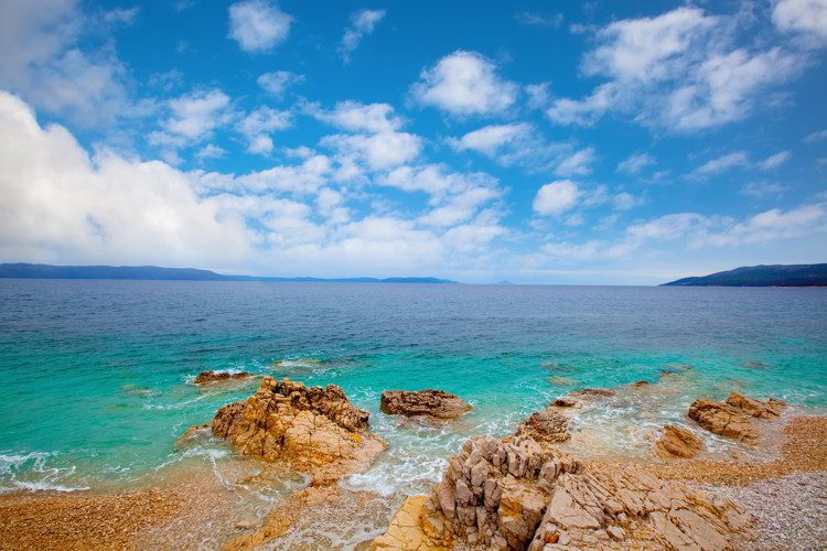 Clear waters under blue sky in the Adriatic coastline, Croatia