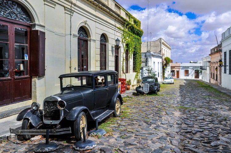 Old black automobile on the street of Colonia del Sacramento, a colonial city in Uruguay