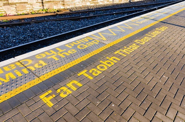 Keep behind the yellow line in Irish