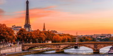 Sunset view of Eiffel tower and Seine river in Paris, France during autumn.