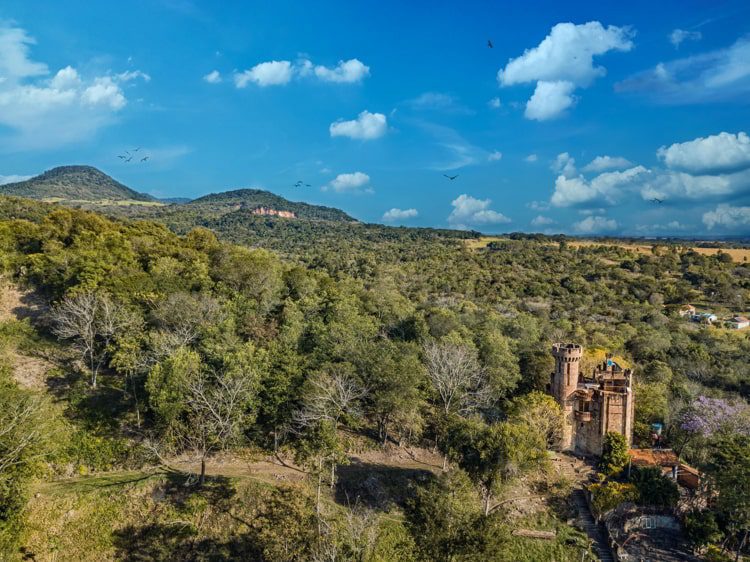 Aerial view of a castle in Paraguay overlooking the Ybytyruzu Mountains