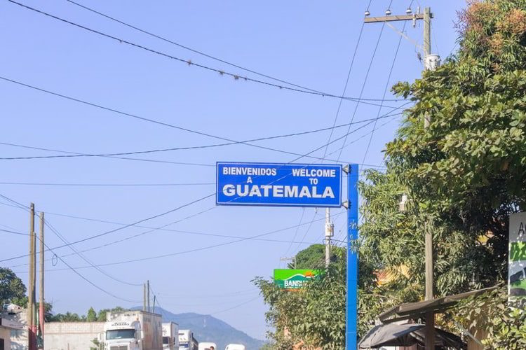 Welcome sign above road at Honduras, Guatemala border in El Florido