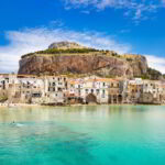 Medieval houses and La Rocca Hill, Cefalu, Sicily, Italy.