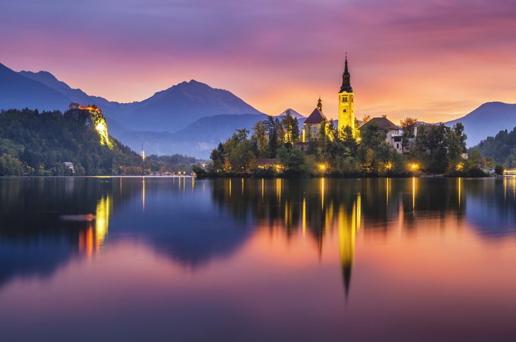 Multicolored sunrise over an alpine lake Bled in Slovenia