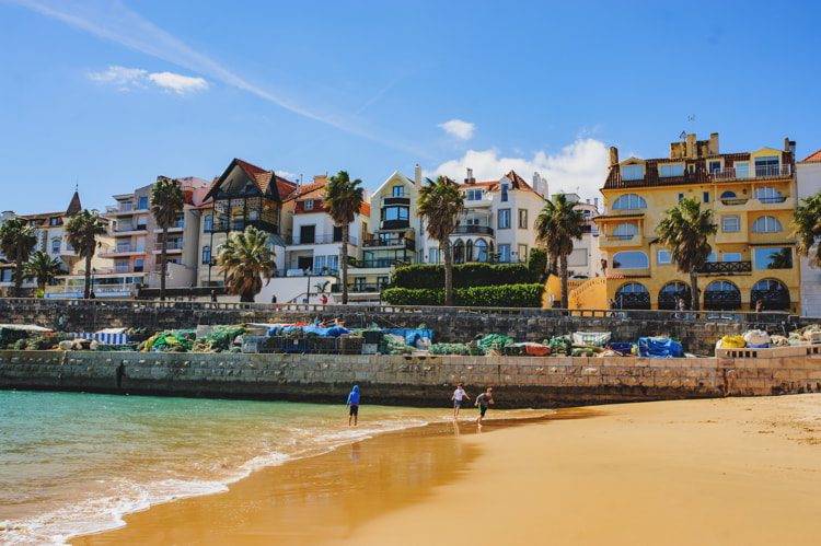 A beautiful view of famous Cascais old city center, beach and tourists