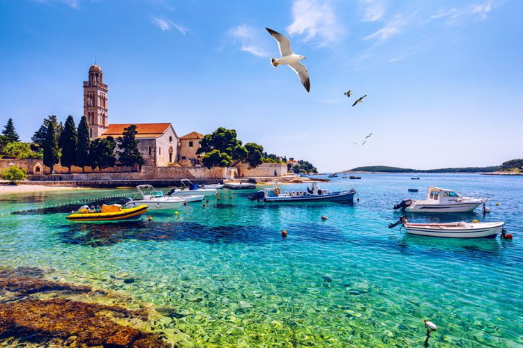 View at amazing archipelago with fishing boats in front of Hvar town, Croatia.