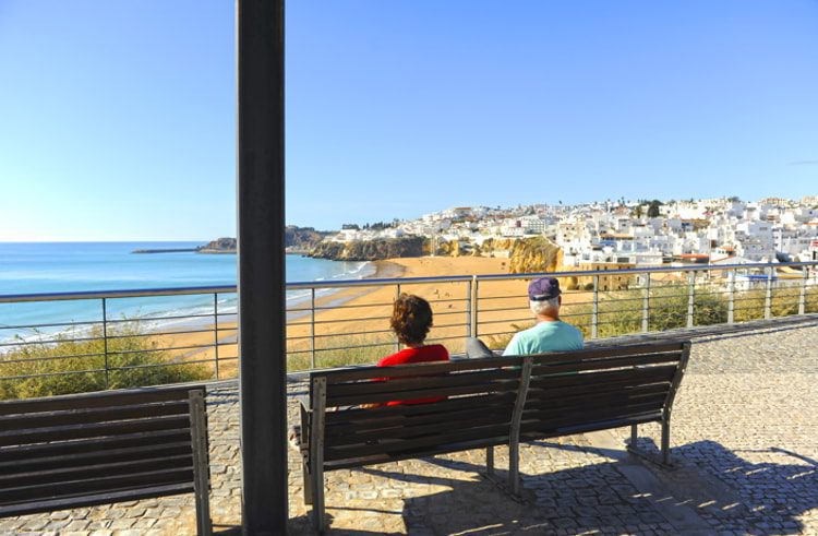 Seniors enjoying the sun at the sea, Lagos, Algarve, Portugal