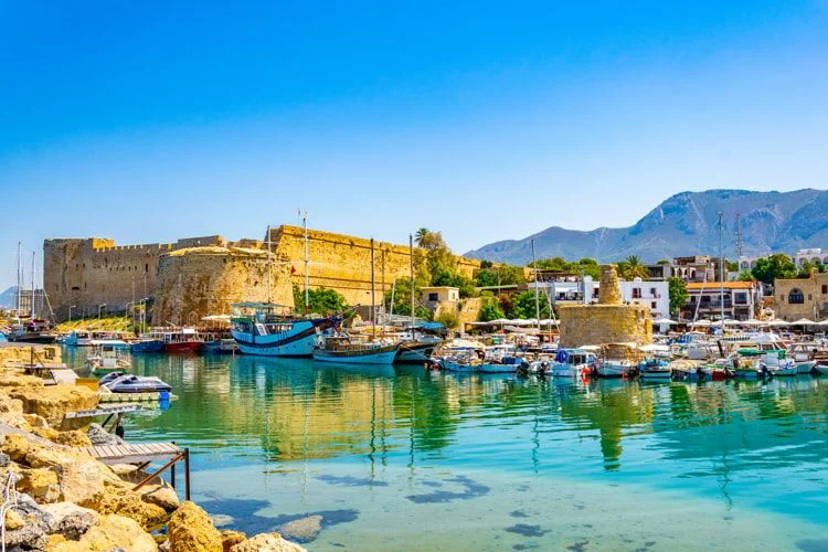 Kyrenia Castle on Northern Cyprus with turquoise waters and a blue sky. life in cyprus