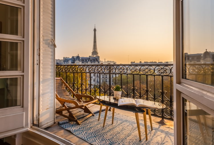 Beautiful Paris balcony at sunset with Eiffel Tower view