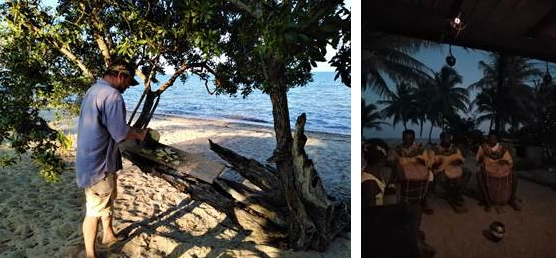 A man in a beach in Blize to the left and people sitting down playing instruments to the right