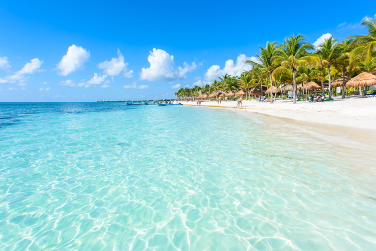 White sands and clear waters in Akumal beach in Mexico