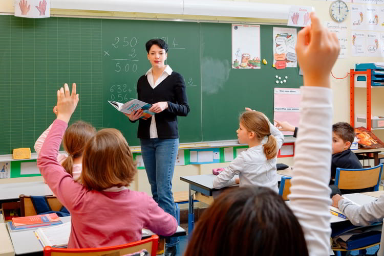 School children in classroom at lesson