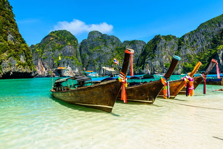 Long-tail boats in Maya Bay, Andaman sea, Thailand. Healthiest Places To Live