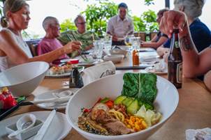 A group of people having lunch in Carmelita Gardens