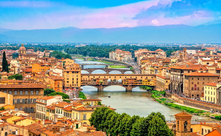 Panoramic view of medieval stone bridge Ponte Vecchio over Arno river in Florence, Tuscany, Italy