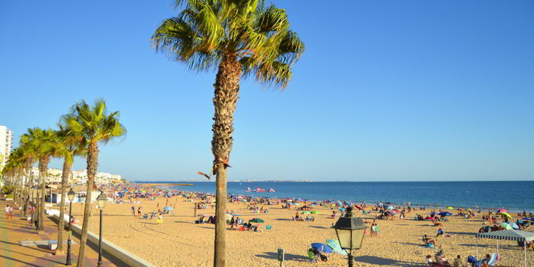 Seafront promenade and Costilla Beach in Rota, Costa de la Luz, Cadiz, Spain. travel europe on a budget