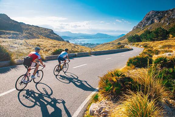 Two people riding bicycles in Spain