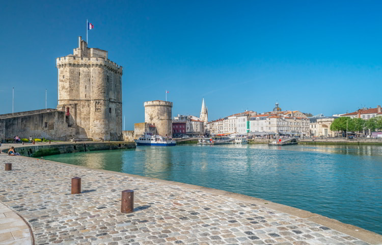 Two medieval towers at La Rochelle harbor, Charente Maritime, France in the summer