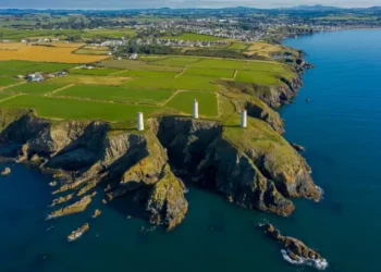 Aerial view, The Metal Man is a 3-metre tall cast-metal figure of a sailor pointing seawards.